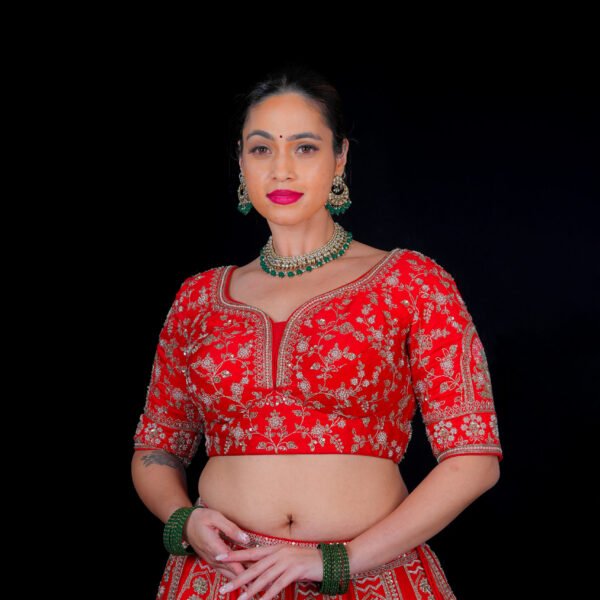 Red Pearl work embroidered Bridal lehenga